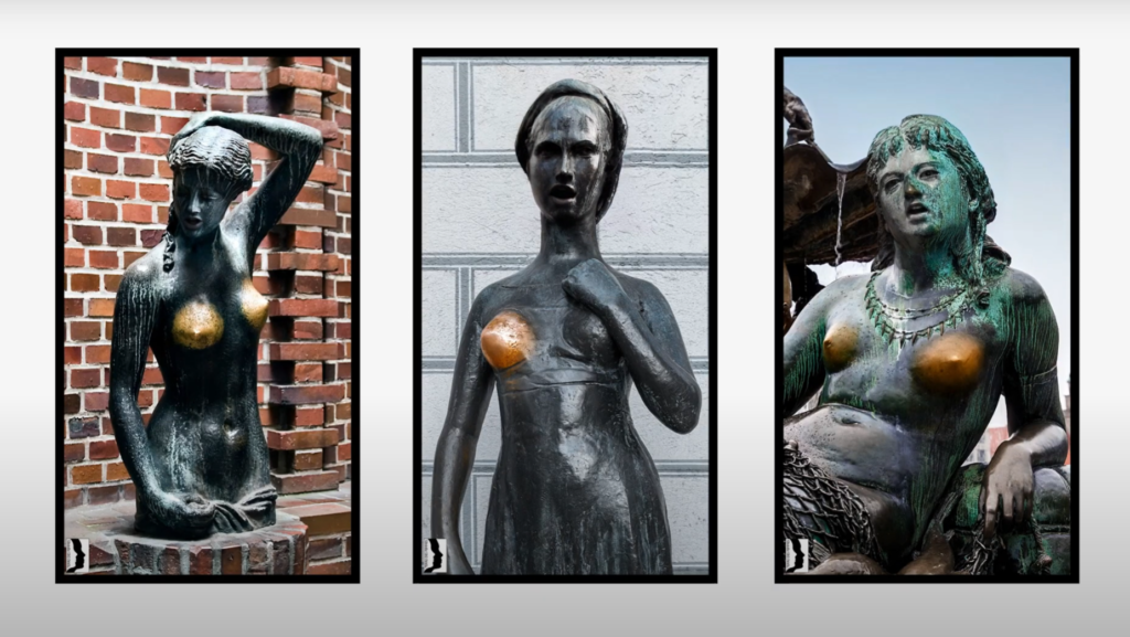 Female bronze statues with their breasts worn significantly showing sexual assault in Germany