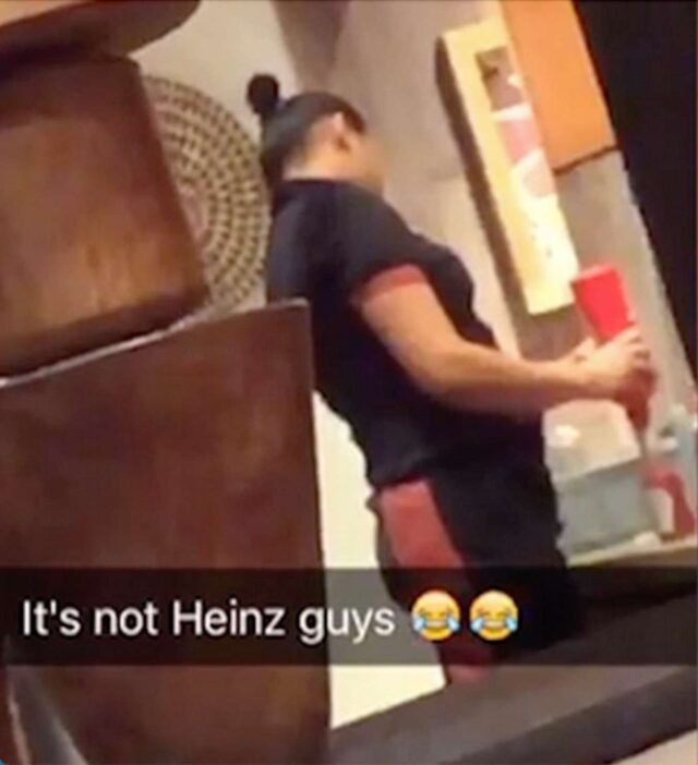 Restaurant employee filling Heinz bottle with fake ketchup