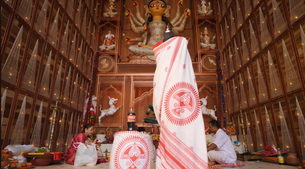 Coca-Cola melted its plastic bottles into yarn, wove them into a Laal Paar saree for Durga Puja Coca-Cola Melted Its Plastic Bottles Into Yarn and Wove Them Into a Laal Paar Saree for Durga Puja