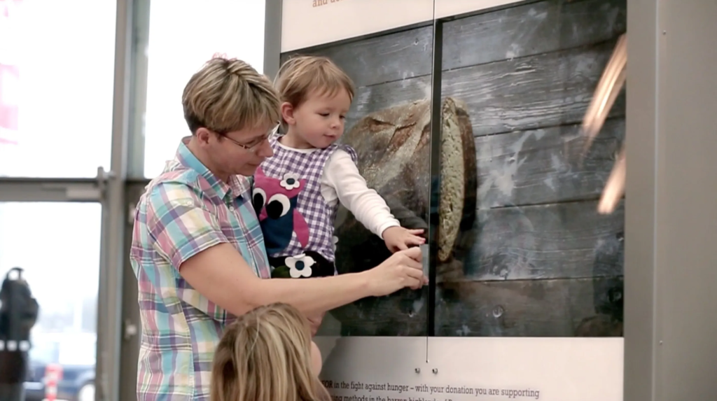 Swiping a credit card through this airport poster cut a slice of bread for a family in Peru image